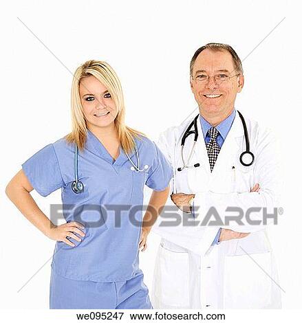 Stock Photo - Successful doctors smiling over a white background. Fotosearch