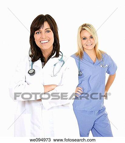 Successful young doctors smiling over a white background View Large Photo Image Stock Image - Successful young doctors smiling over a white background. Fotosearch