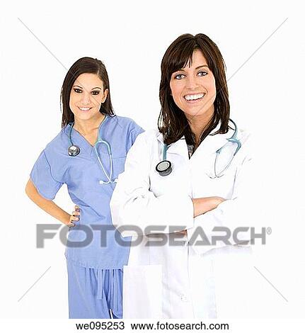 Stock Image - Successful young doctors smiling over a white background. Fotosearch