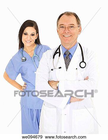 Stock Photo - Successful young doctors smiling over a white background. Fotosearch