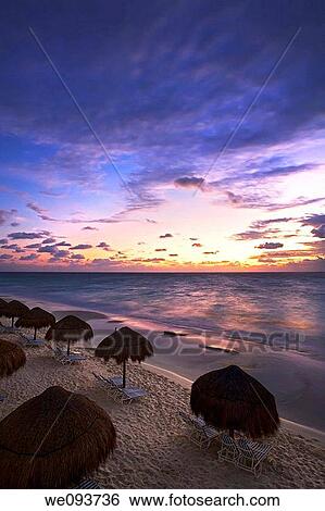 Sunrise along the white sand beaches of Cancun on the Yucatan Peninsula in Quintana Roo Mexico View Large Photo Image Stock Photograph - Sunrise along the white sand beaches of Cancun on the Yucatan Peninsula in Quintana Roo Mexico. Fotosearch