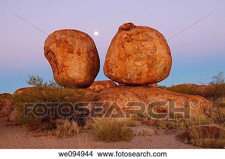 Sunset with moon in Devils Marbles Conservation Reserve, Northern Territory, Australia View Large Photo Image Picture - Sunset with moon in Devils Marbles Conservation Reserve, Northern Territory, Australia. Fotosearch