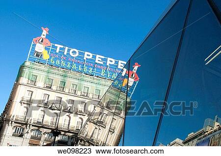 T? o Pepe neon sign reflected on glass facade of new station, Puerta del Sol. Madrid, Spain. View Large Photo Image Stock Image - T? o Pepe neon sign reflected on glass facade of new station, Puerta del Sol. Madrid, Spain.. Fotosearch