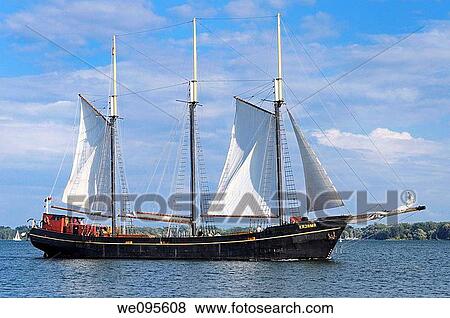Tall sailing ship sightseeing boat cruise in the Toronto harbor on Lake Ontario View Large Photo Image Stock Photo - Tall sailing ship sightseeing boat cruise in the Toronto harbor on Lake Ontario. Fotosearch