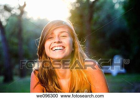 Stock Image - Teen in a garden. Fotosearch