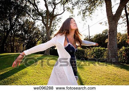 Teen in a garden View Large Photo Image Stock Photo - Teen in a garden. Fotosearch