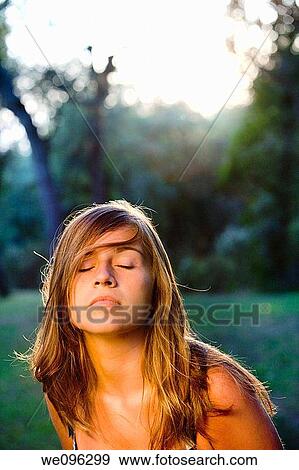 Teen in a garden View Large Photo Image Stock Photo - Teen in a garden. Fotosearch