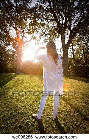 Teen in a garden View Large Photo Image Stock Photograph - Teen in a garden. Fotosearch