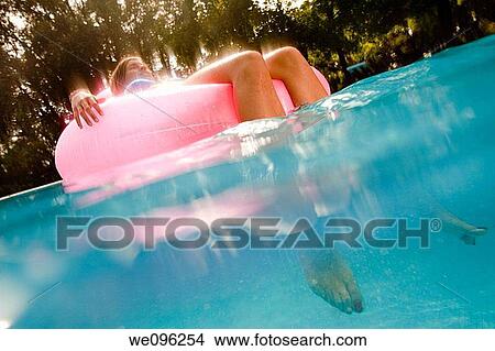 Teen in a pool View Large Photo Image Picture - Teen in a pool. Fotosearch