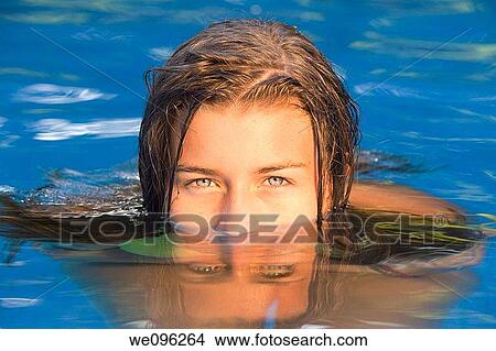 Teen in a pool View Large Photo Image Picture - Teen in a pool. Fotosearch