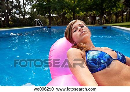 Teen in a pool View Large Photo Image Stock Image - Teen in a pool. Fotosearch