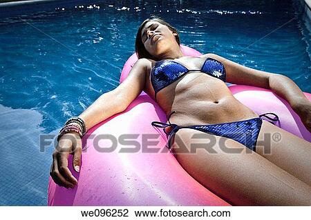 Teen in a pool View Large Photo Image Stock Image - Teen in a pool. Fotosearch