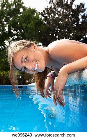 Teen in a pool View Large Photo Image Stock Photo - Teen in a pool. Fotosearch