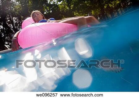 Teen in a pool View Large Photo Image Stock Photo - Teen in a pool. Fotosearch