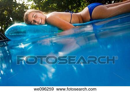 Teen in a pool View Large Photo Image Stock Photo - Teen in a pool. Fotosearch