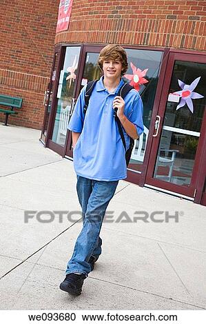 Teenage boy leaving school building View Large Photo Image Stock Image - Teenage boy leaving school building. Fotosearch