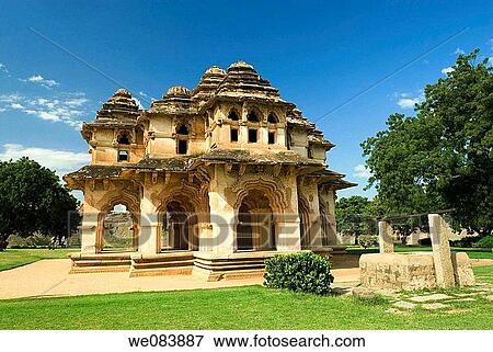 The Lotus Mahal in Hampi, Karnataka. The Lotus Mahal, shaped like a lotus flower from top, this two-story structure has beautiful arc ways set in geometric regularity. It was an air-cooled summer palace of the queen. The ruins of Hampi of the 14 -16th Cent View Large Photo Image Stock Photo - The Lotus Mahal in Hampi, Karnataka. The Lotus Mahal, shaped like a lotus flower from top, this two-story structure has beautiful arc ways set in geometric regularity. It was an air-cooled summer palace of the queen. The ruins of Hampi of the 14 -16th Cent. Fotosearch