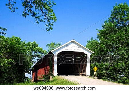 Stock Photograph - The McAllister Covered Bridge crosses Little Raccoon Creek on County Road East 400 South, in Parke County This single span Burr Arch Truss structure has a length of 126 feet, or 144 feet including the 9-foot overhang at each end Built in 1914 by Joseph. Fotosearch