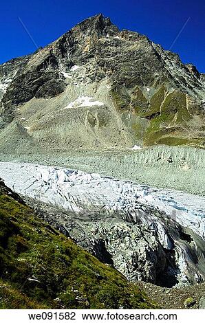 The peak Pointe de Moiry throwning above the Moiry glacier, Pennine Alps, Valais, Switzerland View Large Photo Image Stock Image - The peak Pointe de Moiry throwning above the Moiry glacier, Pennine Alps, Valais, Switzerland. Fotosearch