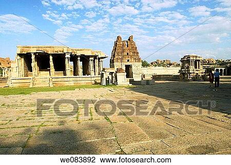 The Stone chariot and the Vijayavittala Temple tower in Hampi, karnataka. The construction of Vittala temple started during the reign of King Krishna Deva Raya in the year 1513 AD. The project was so colossal that the additions continued for almost five d View Large Photo Image Stock Image - The Stone chariot and the Vijayavittala Temple tower in Hampi, karnataka. The construction of Vittala temple started during the reign of King Krishna Deva Raya in the year 1513 AD. The project was so colossal that the additions continued for almost five d. Fotosearch