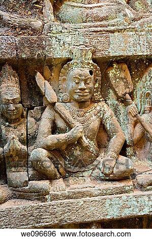 Stock Photograph - The Terrace of the Leper King is located in the northwest corner of the Royal Square of Angkor Thom, which is part of the Ankgor Wat complex in northern Cambodia. Fotosearch