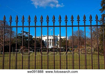 Stock Photo - The White House behind iron gate. Fotosearch