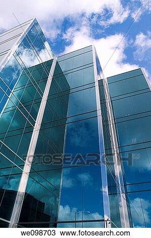 Three towers of a sleek modern glass office building in Silicon Valley with the clouds and sky reflecting in the surface. San Mateo, California, USA. View Large Photo Image Stock Image - Three towers of a sleek modern glass office building in Silicon Valley with the clouds and sky reflecting in the surface. San Mateo, California, USA.. Fotosearch