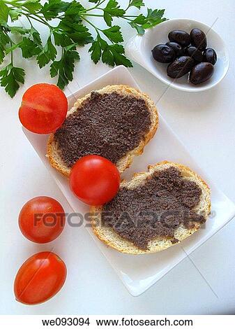 Picture - Toast with tomato and olive pate. Fotosearch