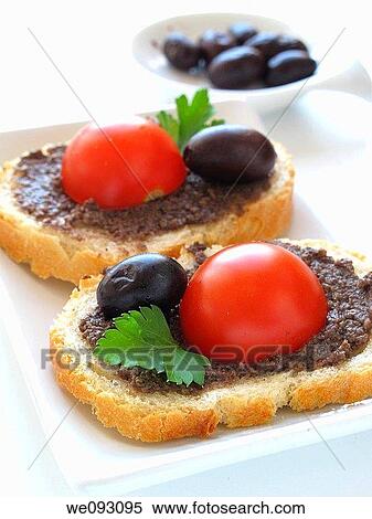 Toast with tomato and olive pate View Large Photo Image Stock Photography - Toast with tomato and olive pate. Fotosearch