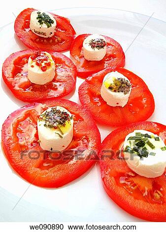 Tomato slices with goat cheese, herbs and spices View Large Photo Image Stock Image - Tomato slices with goat cheese, herbs and spices. Fotosearch
