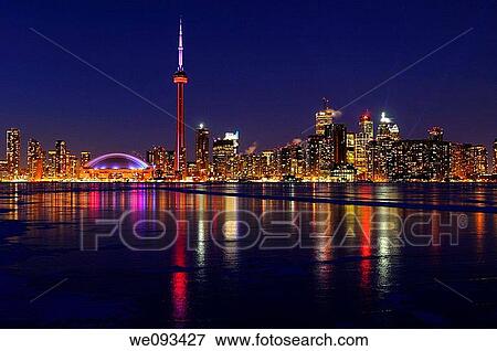 Toronto city skyline lights at night reflected on the frozen ice covered Lake Ontario View Large Photo Image Stock Photo - Toronto city skyline lights at night reflected on the frozen ice covered Lake Ontario. Fotosearch
