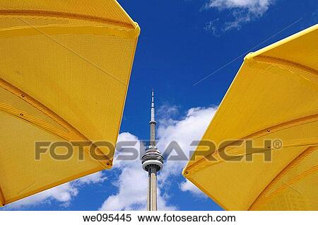 Toronto CN tower between two yellow beach umbrellas at urban beach of HTO Park View Large Photo Image Stock Photography - Toronto CN tower between two yellow beach umbrellas at urban beach of HTO Park. Fotosearch