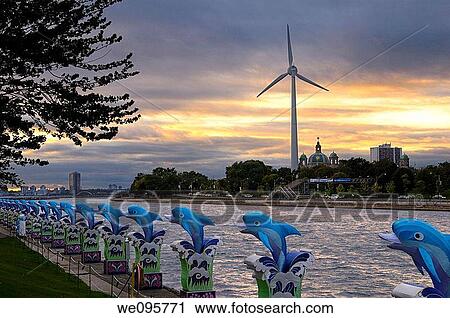 Toronto skyline at dusk with wind turbine and blue dolphins from Ontario Place View Large Photo Image Stock Image - Toronto skyline at dusk with wind turbine and blue dolphins from Ontario Place. Fotosearch