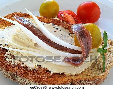 Tostadas con queso, anchoas, tomate, aceitunas y cebolla View Large Photo Image Stock Photography - Tostadas con queso, anchoas, tomate, aceitunas y cebolla. Fotosearch