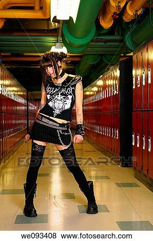 Tough young female heavy metal punk rocker in a basement school locker room View Large Photo Image Stock Photo - Tough young female heavy metal punk rocker in a basement school locker room. Fotosearch