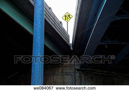 Stock Photo - Traffic sign with two arrows at the intersection of two highways.. Fotosearch