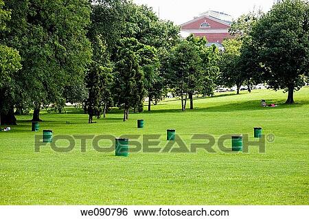 Trash containers in a city park View Large Photo Image Stock Photograph - Trash containers in a city park. Fotosearch