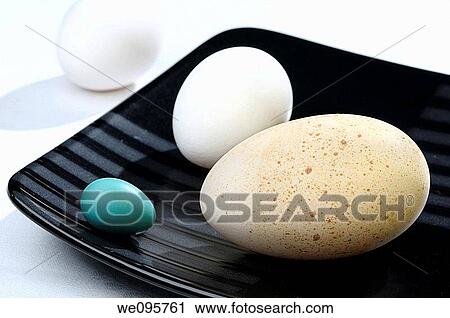 Turkey Chicken and Robin eggs on a black plate on a white table cloth View Large Photo Image Stock Image - Turkey Chicken and Robin eggs on a black plate on a white table cloth. Fotosearch