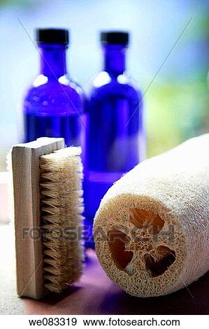 two blue glass bottles, sponge and brush in the bathroom View Large Photo Image Stock Photo - two blue glass bottles, sponge and brush in the bathroom. Fotosearch