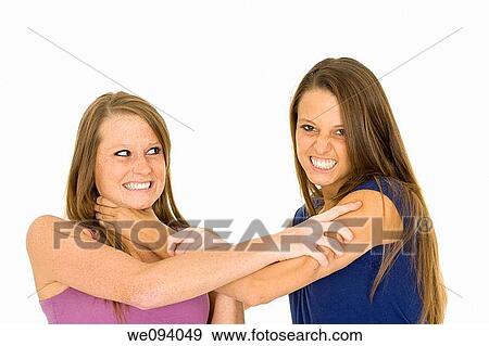 Two caucasian woman fighting on white background View Large Photo Image Stock Photo - Two caucasian woman fighting on white background. Fotosearch