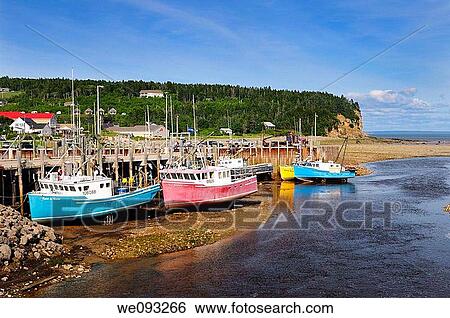Upper Salmon River and fishing boats at low tide on the Bay of Fundy at Alma New Brunswick View Large Photo Image Stock Photograph - Upper Salmon River and fishing boats at low tide on the Bay of Fundy at Alma New Brunswick. Fotosearch