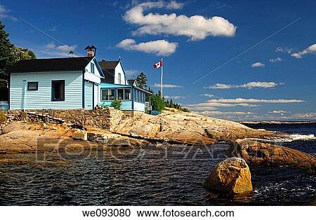 Vacation homes on the rocky bank of the St Lawrence River, Tadoussac, Canada View Large Photo Image Stock Image - Vacation homes on the rocky bank of the St Lawrence River, Tadoussac, Canada. Fotosearch