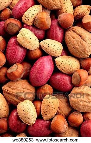Stock Image - Variety of nuts: peacans, walnuts, almond and hazelnuts, full frame. Fotosearch