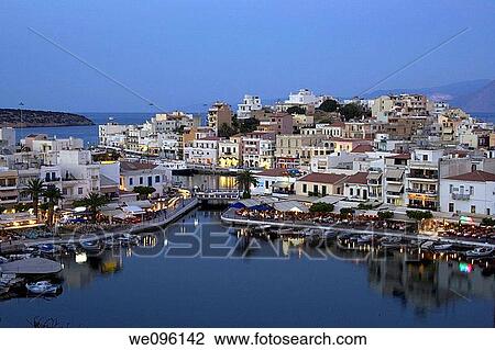 Stock Image - View of Agios Nikolaos at Dusk, Crete, Greek Islands. Fotosearch