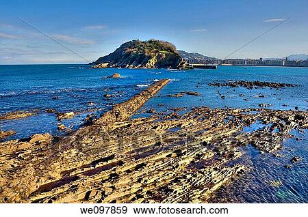 View of low tide in the Bay of San Sebastian, with the island of Santa Clara Guip·zcoa, Basque Country, Spain View Large Photo Image Stock Photo - View of low tide in the Bay of San Sebastian, with the island of Santa Clara Guip·zcoa, Basque Country, Spain. Fotosearch