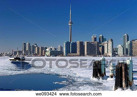 Wards Island Ferry returning to Toronto in winter on an ice covered Lake Ontario View Large Photo Image Picture - Wards Island Ferry returning to Toronto in winter on an ice covered Lake Ontario. Fotosearch