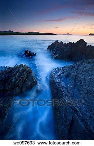 water breaking around rocks long exposure View Large Photo Image Stock Image - water breaking around rocks long exposure. Fotosearch