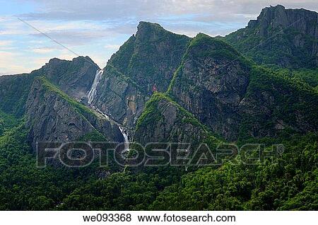 Waterfalls plunging into Western Brook Pond with steep rock cliff at Gros Morne National Park Newfoundland View Large Photo Image Stock Photo - Waterfalls plunging into Western Brook Pond with steep rock cliff at Gros Morne National Park Newfoundland. Fotosearch