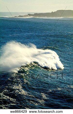 Waves at Biscay coast with Izaro island in background, Basque Country, Spain View Large Photo Image Stock Photo - Waves at Biscay coast with Izaro island in background, Basque Country, Spain. Fotosearch