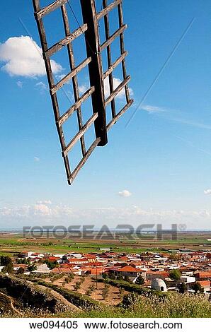 Windmill arm and village. Mota del Cuervo, Cuenca province, Castilla La Mancha, Spain. View Large Photo Image Stock Photography - Windmill arm and village. Mota del Cuervo, Cuenca province, Castilla La Mancha, Spain.. Fotosearch